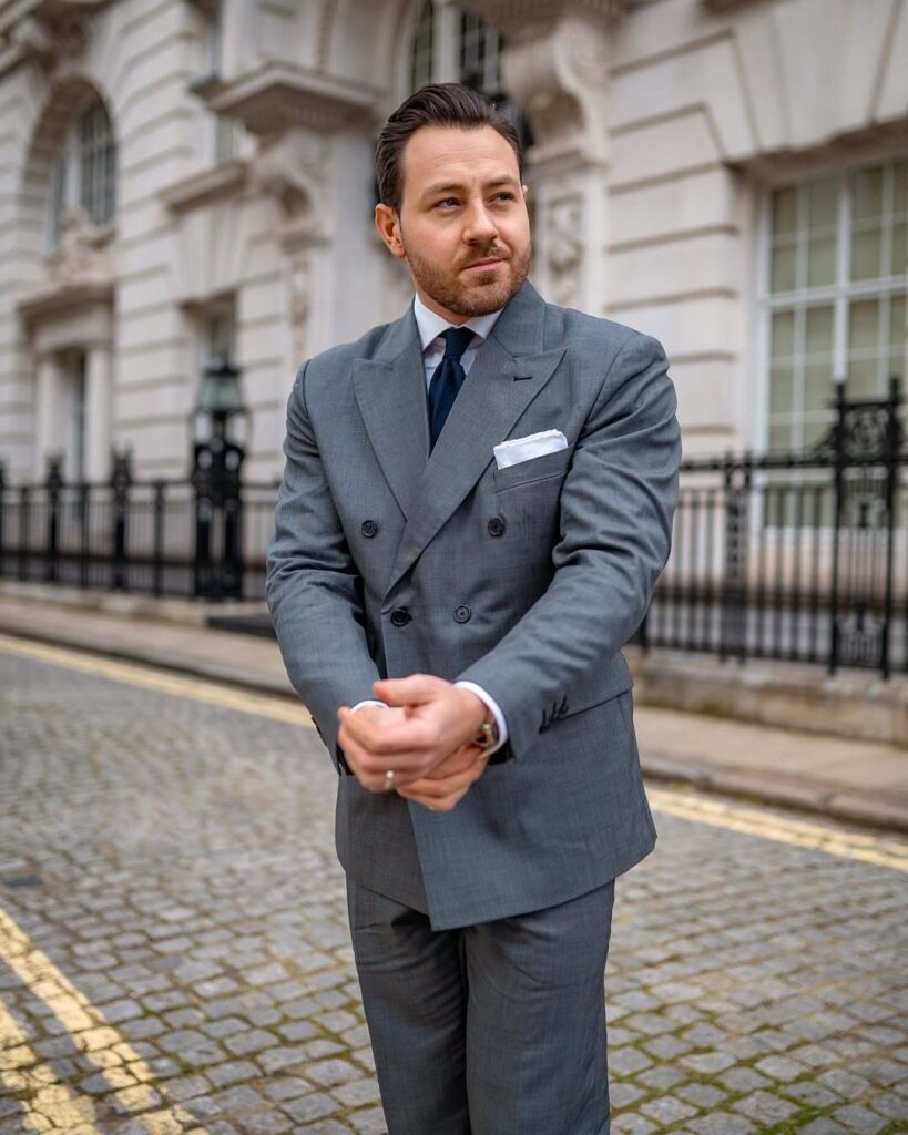classic grey double breasted suit with navy tie 2024 12 17 11 24 37